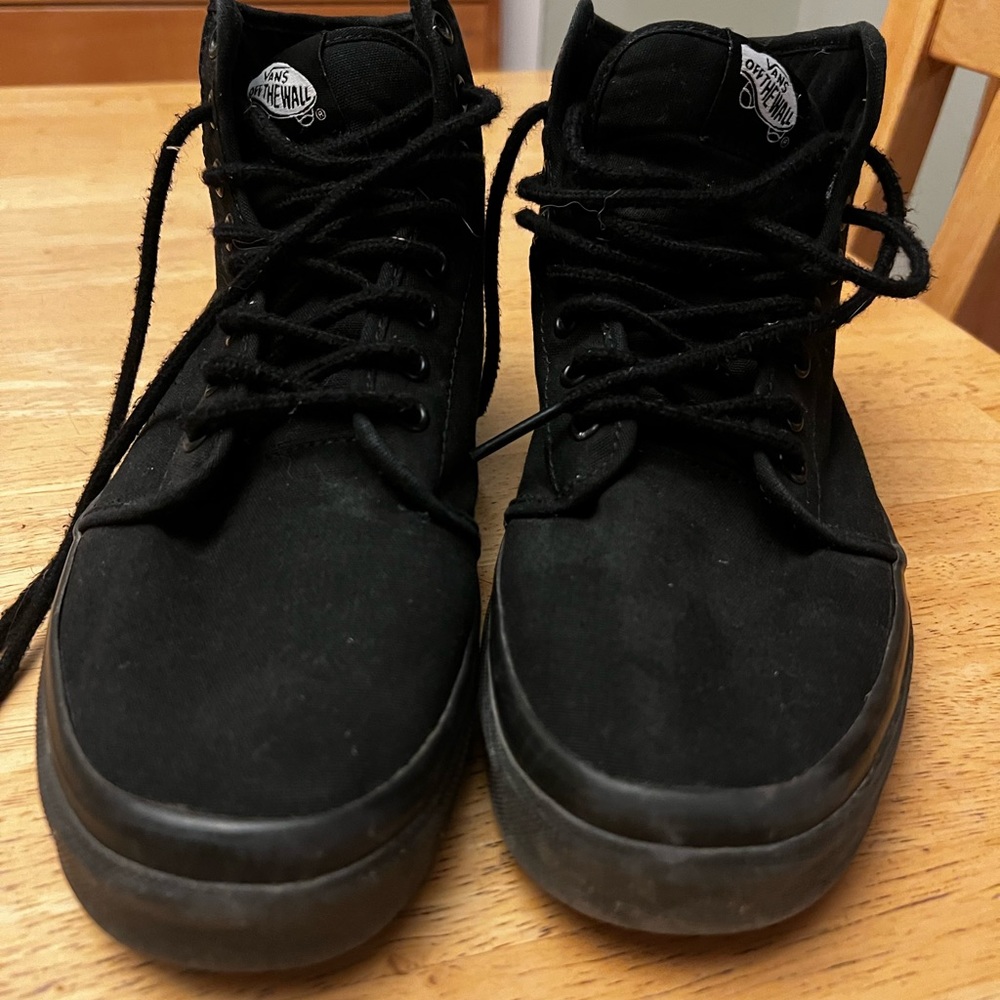 Old school black vans high tops.